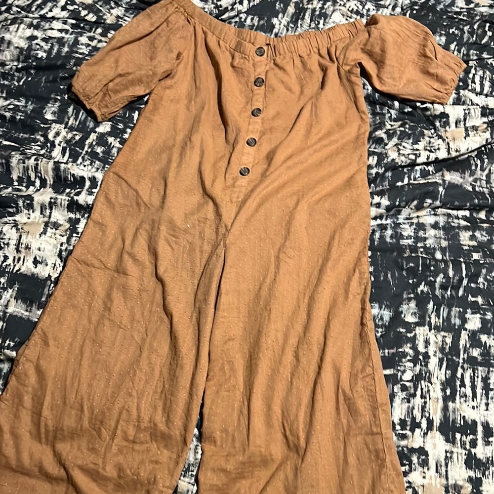 A women’s jumpsuit. Fake buttons